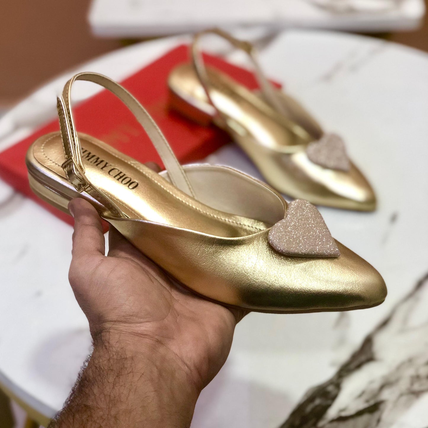 JC gold pumps