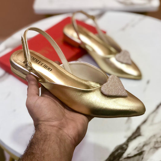 JC gold pumps